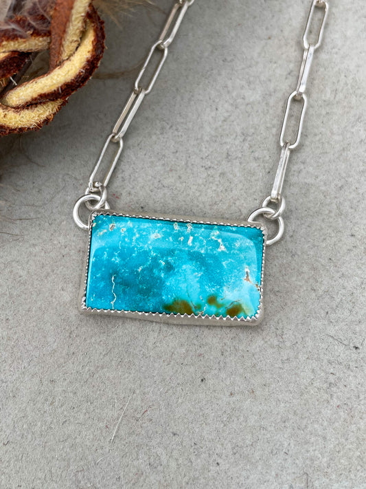 sierra bella turquoise bar necklace of high end turquoise set in a serrated bezel on a paperclip chain