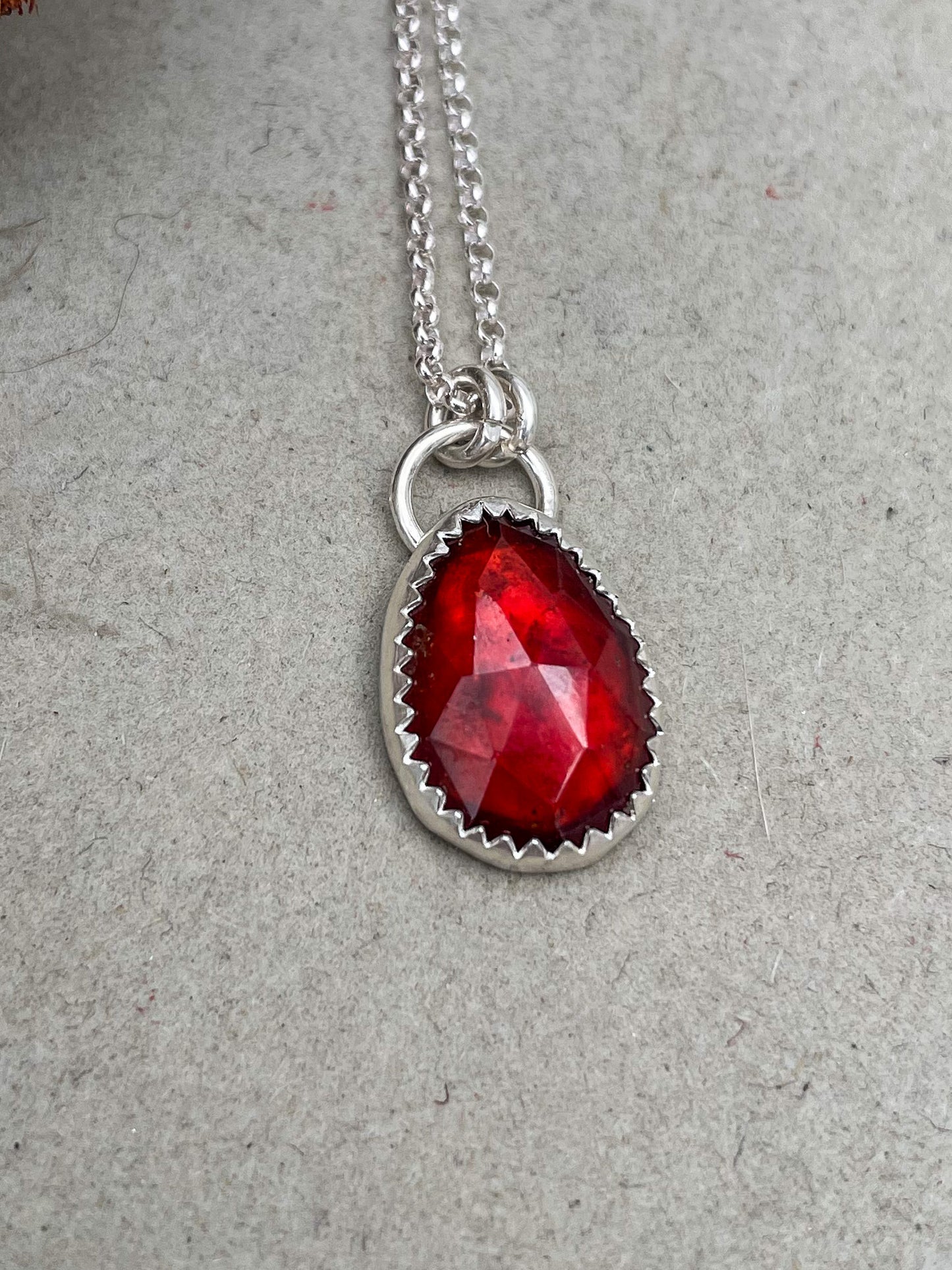 small freeform rosecut garnet hung from oversized bail on a dainty rolo chain