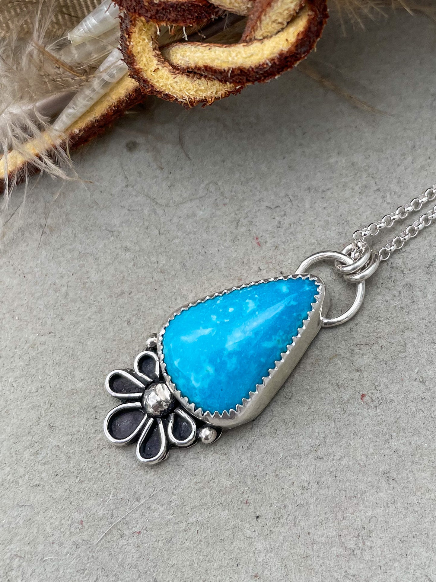 triangular kingman turquoise with handcrafted floral design with accent beads hung on dainty rolo chain