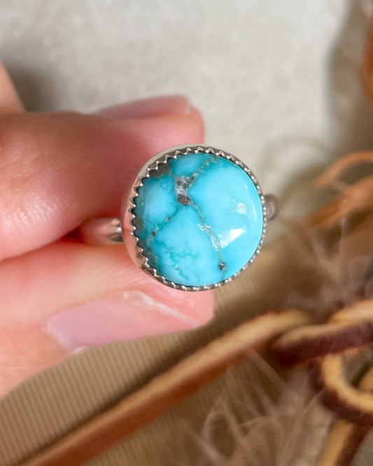 round white water turquoise ring handcrafted in serrated bezel on a half round band
