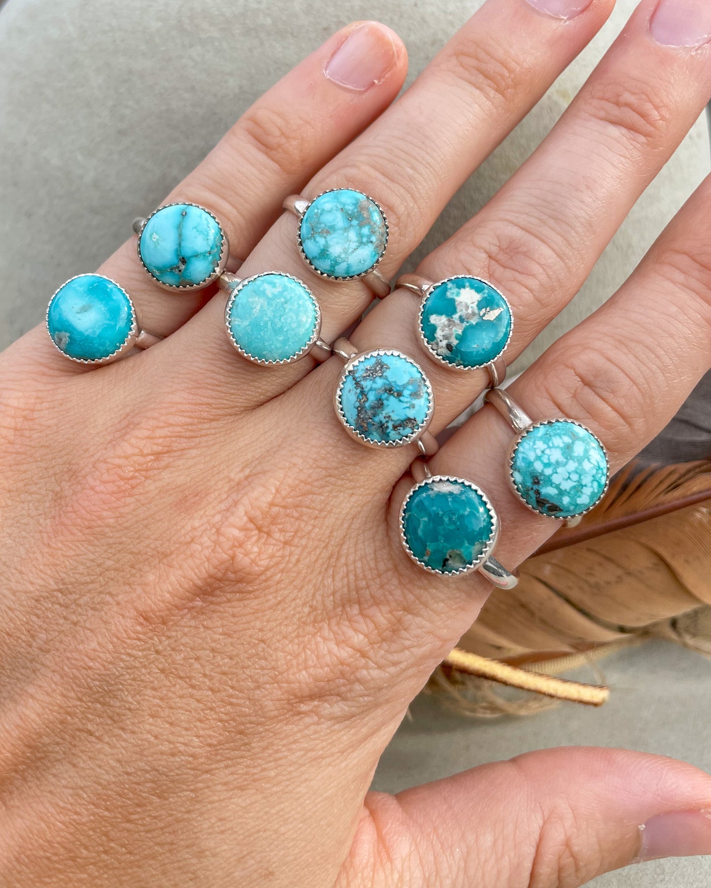 round white water turquoise ring handcrafted in serrated bezel on a half round band