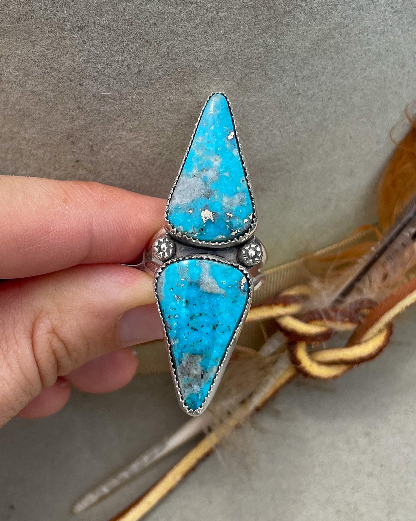 handcrafted ithica peak turquoise double triangular stone ring with natural pyrite set in serrated bezels with floral beads on a split shank band