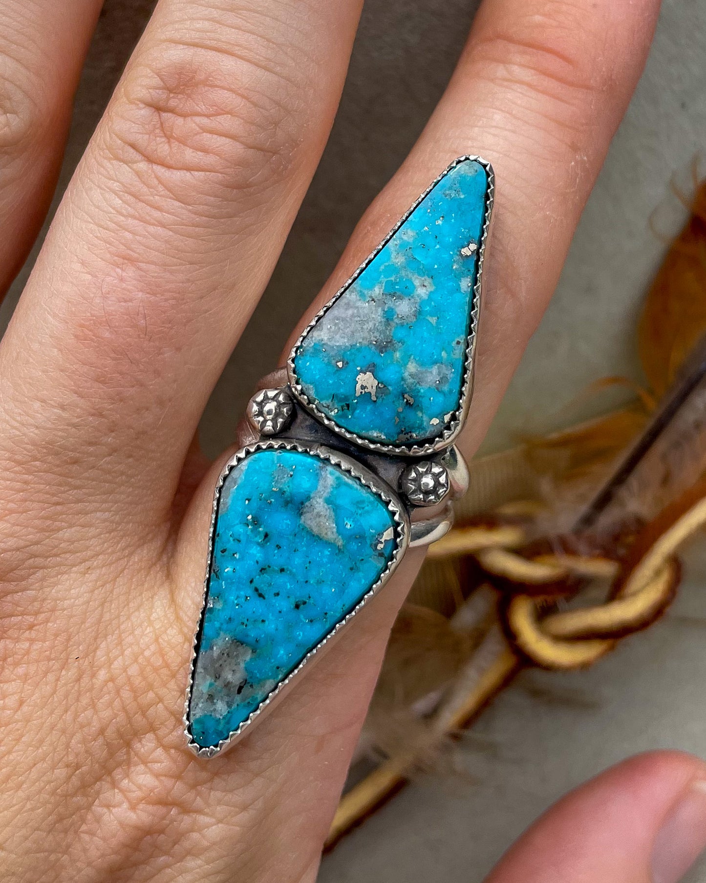 handcrafted ithica peak turquoise double triangular stone ring with natural pyrite set in serrated bezels with floral beads on a split shank band