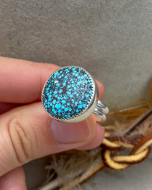 medium sized handmade natural spiderweb kingman turquoise round ring with natural pyrite fleck in a serrated bezel on a double half round band