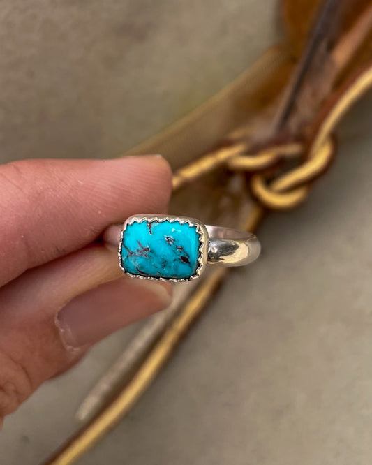 east to west bezel set blue royston turquoise small rectangular stone rings on chunky silver band