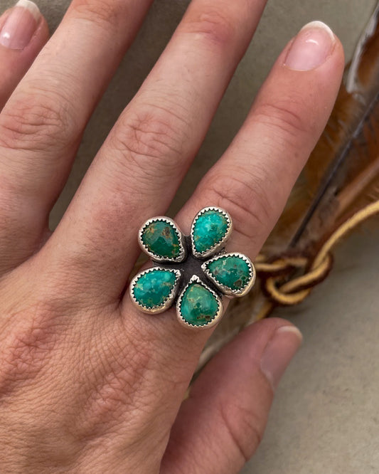 Playful one-of-a-kind Emerald Valley Turquoise flower ring. Chunky silver band, vibrant green stones in serrated bezels. Statement ring for everyday wear.