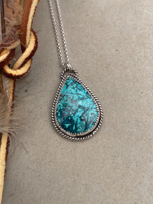 teardop shaped chrysocolla pendant with twist rope border on dainty rolo chain