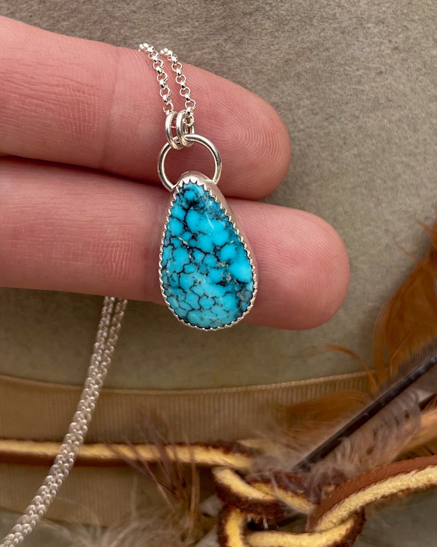 spiderweb kingman turquoise tearadrop pendant on dainty rolo chain