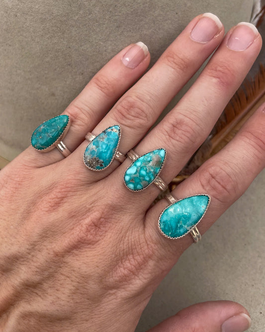 elongated pear white water turquoise ring on double half round band