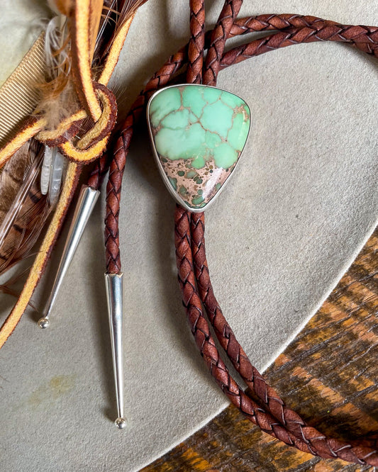 bolo tie with brown leather cord and mint green torque stone