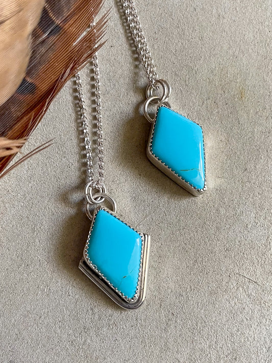 two diamond shaped sleeping beauty pendants on dainty rolo chains