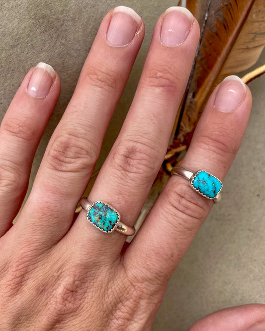 two east to west bezel set royston turquoise small rectangular stone rings on chunky silver band