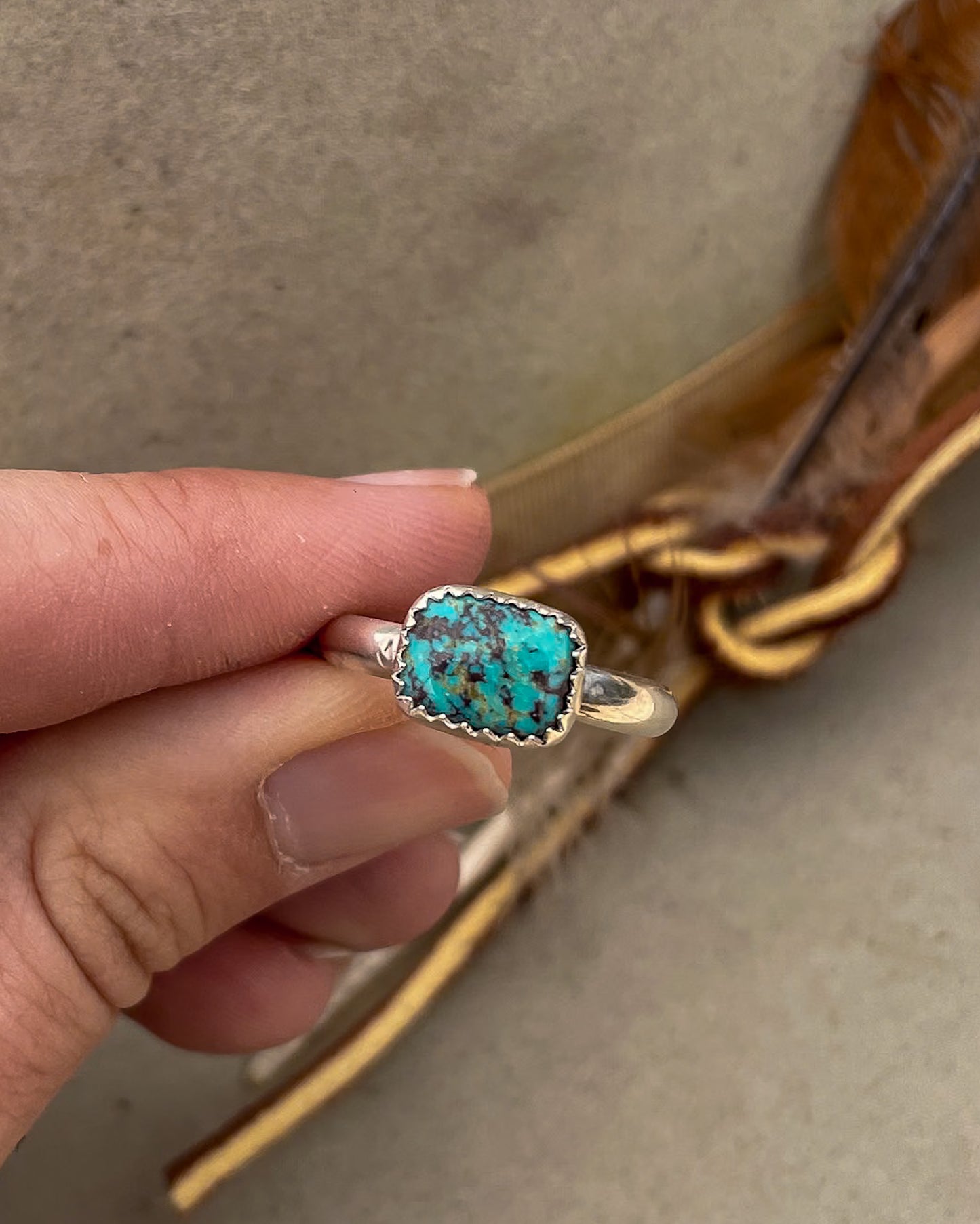 east to west bezel set teal green royston turquoise small rectangular stone rings on chunky silver band