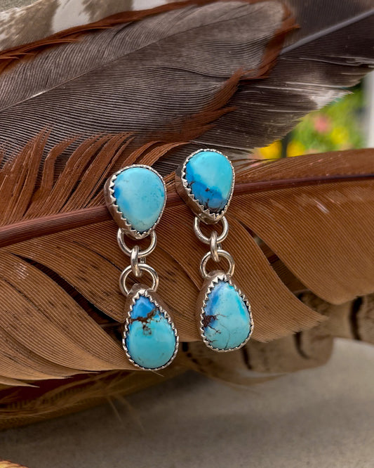 golden hill turquoise earrings with pear shaped stud and pear dangle hanging from the point