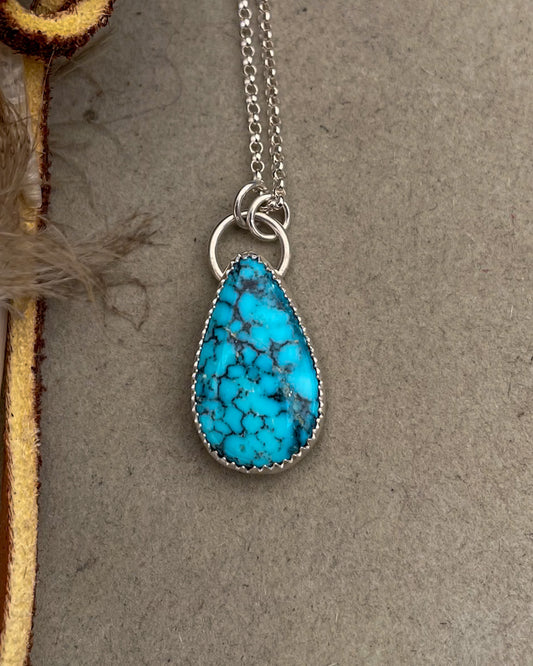 spiderweb kingman turquoise tearadrop pendant on dainty rolo chain
