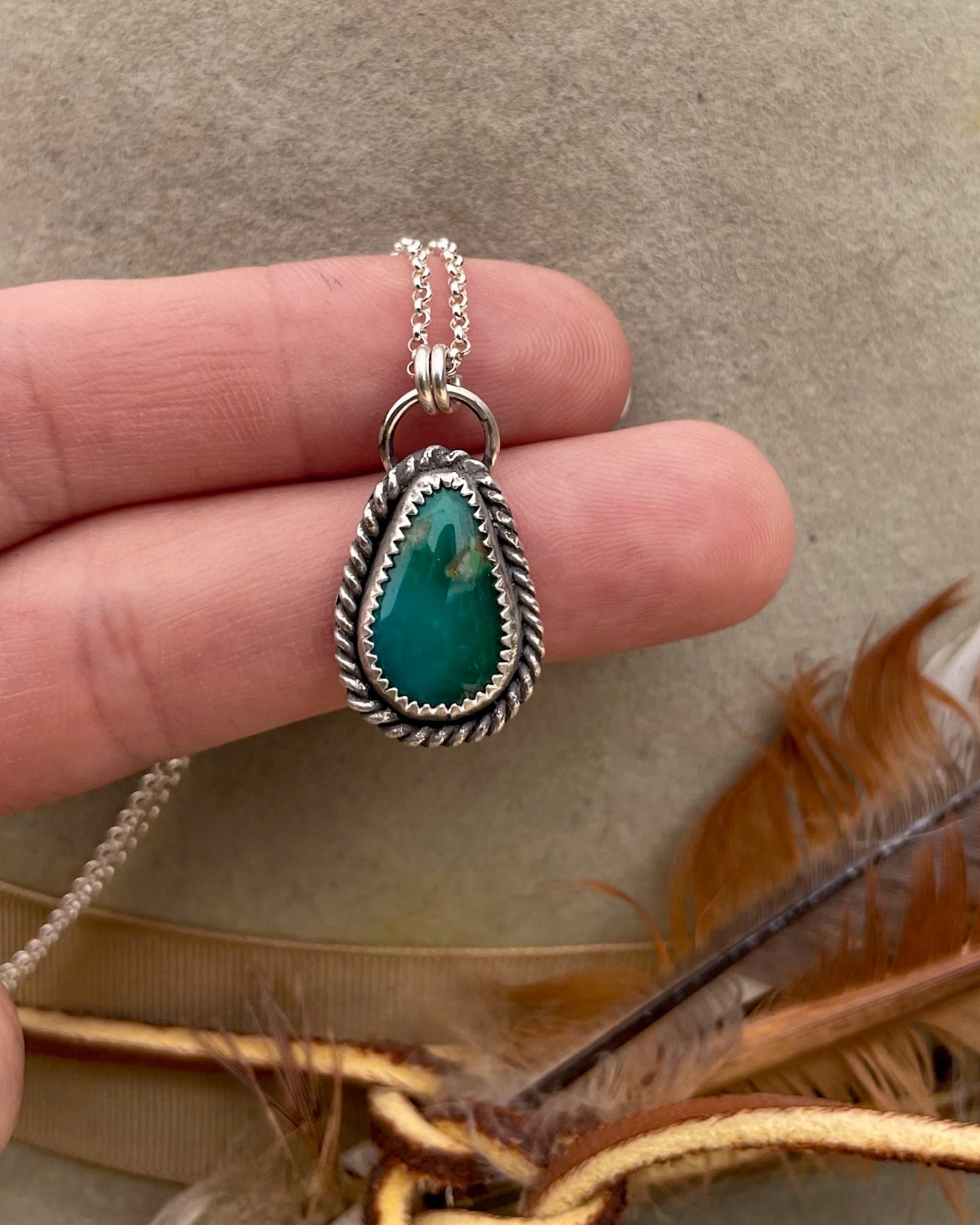 green turquoise teardrop pendant with twisted rope border on dainty rolo chain
