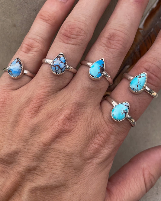 five small golden hills turquoise pear rings on chunk silver bands