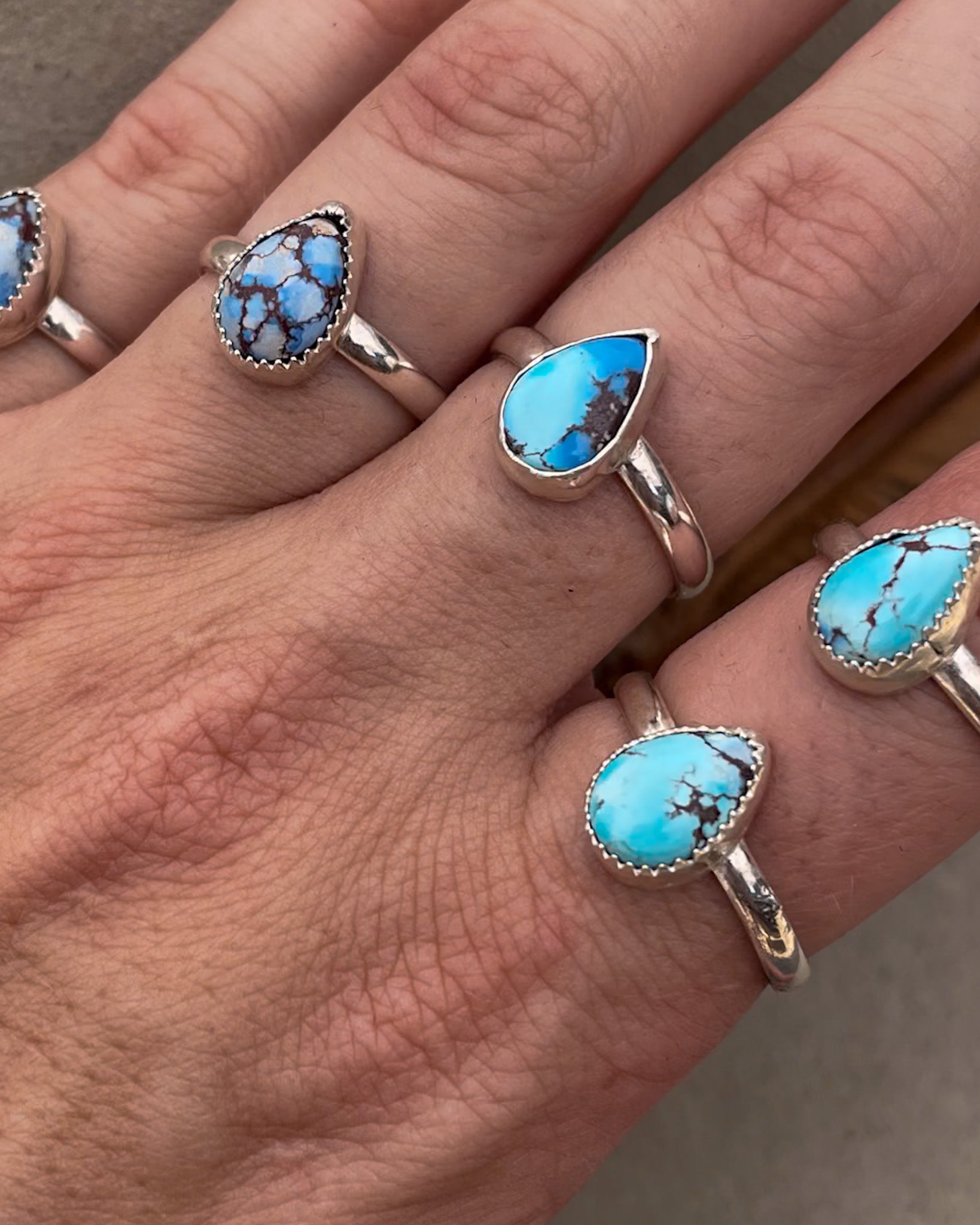 five small golden hills turquoise pear rings on chunk silver bands