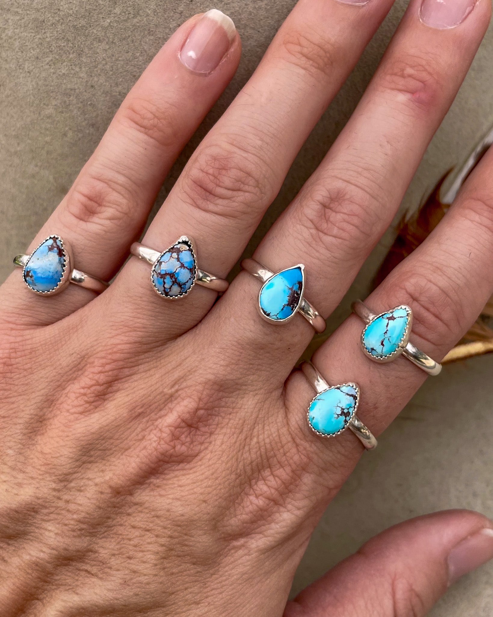 five small golden hills turquoise pear rings on chunk silver bands