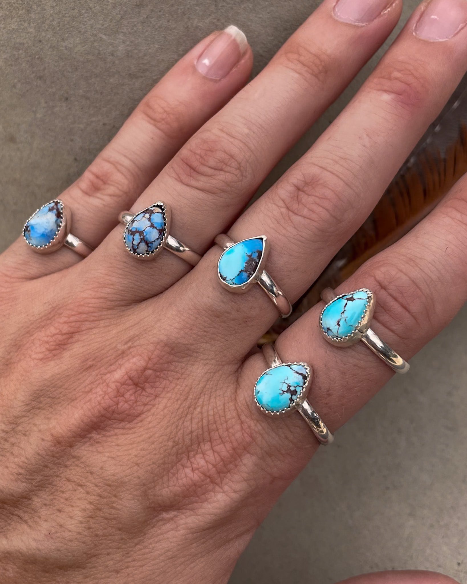 five small golden hills turquoise pear rings on chunk silver bands