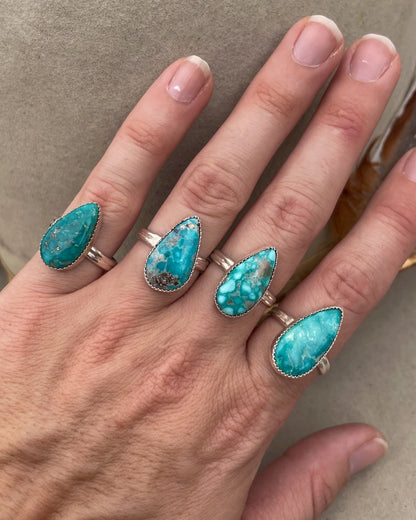elongated pear white water turquoise ring on double half round band