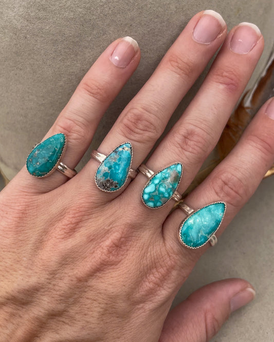 elongated pear white water turquoise ring on double half round band