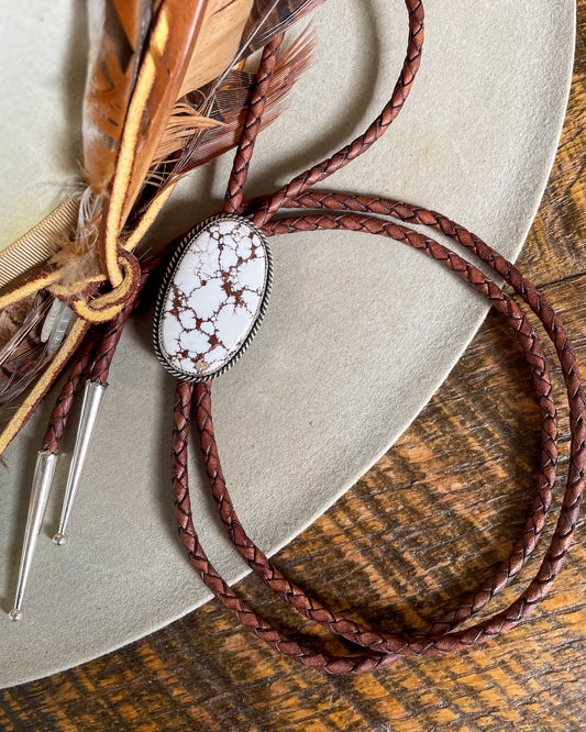 Bolo tie with brown cord and large wild horse magnesite stone