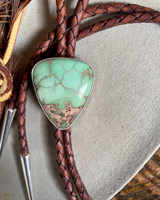 bolo tie with brown leather cord and mint green torque stone