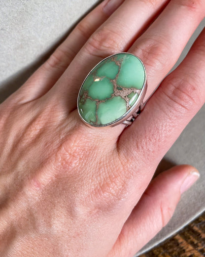 Large oval mint green turquoise ring on hand
