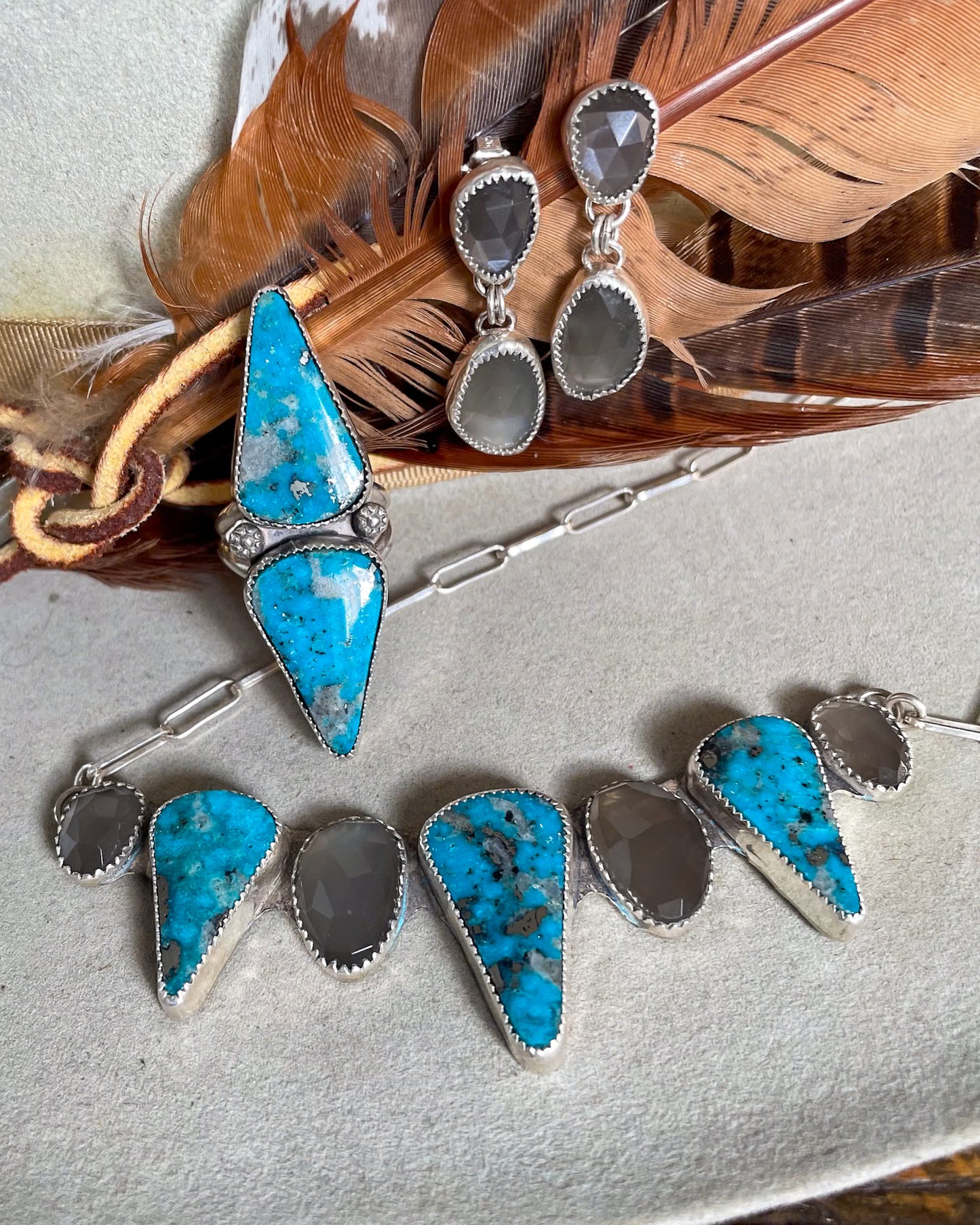 ithaca peak turquoise two stone ring with matching necklace with alternating grey moonstone and ithaca peak stones and grey moonstone drop earrings