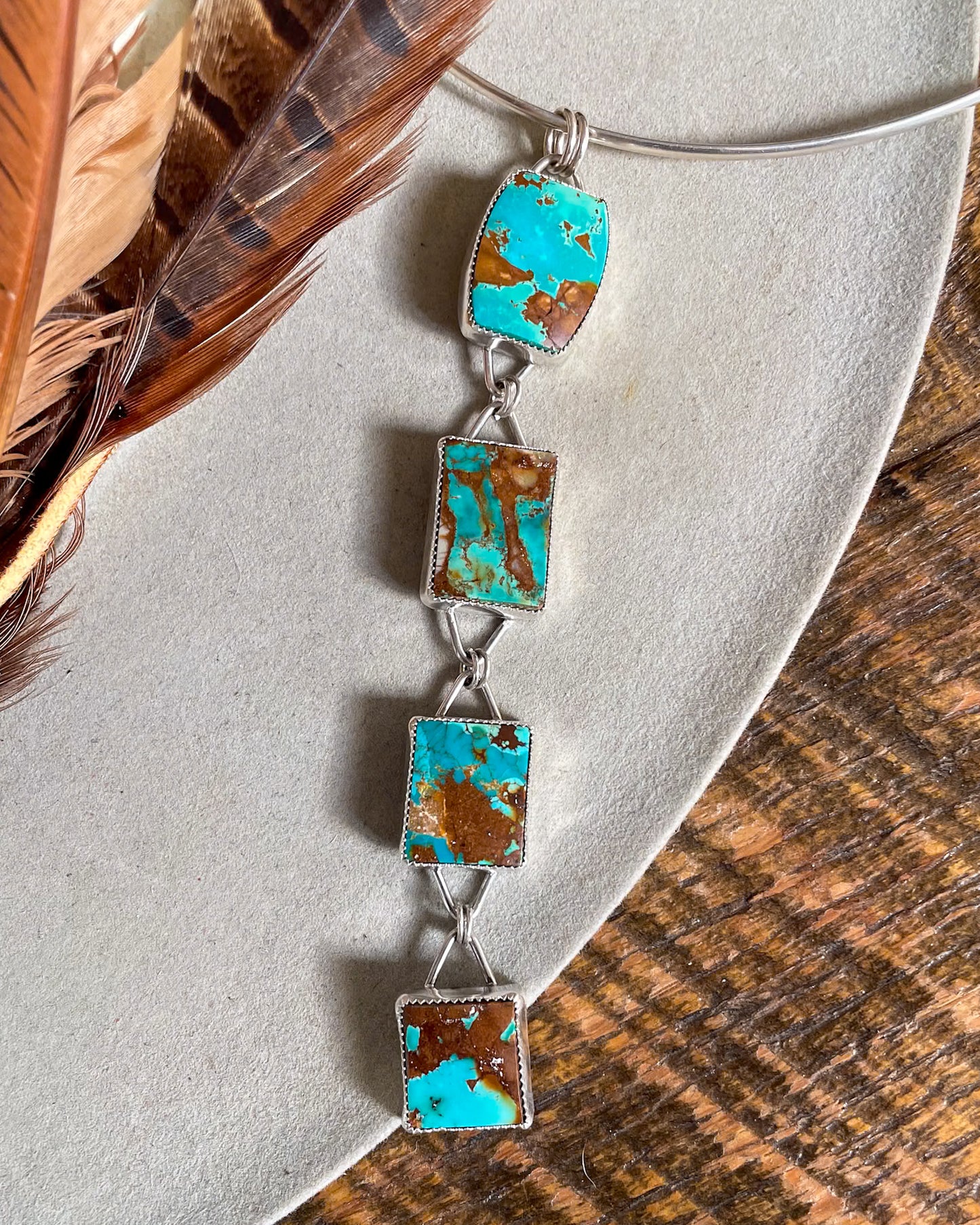 four stone pilot mountain turquoise pendant with rectangular stones connected in a row