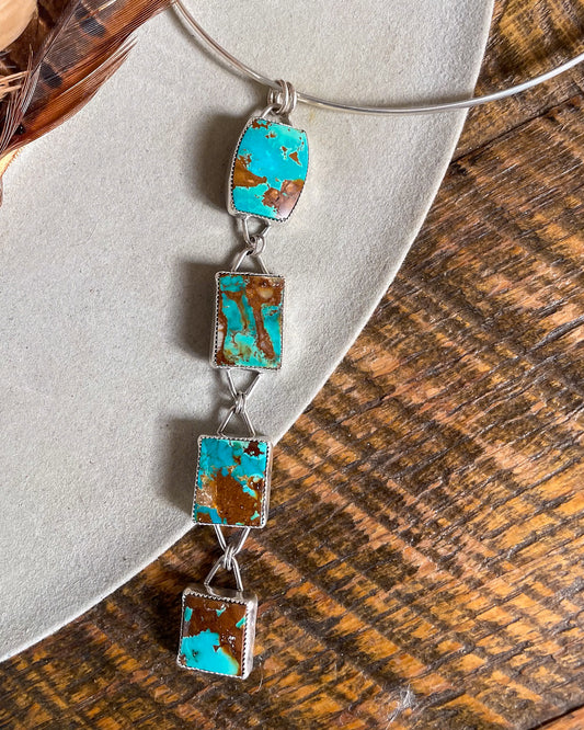 four stone pilot mountain turquoise pendant with rectangular stones connected in a row