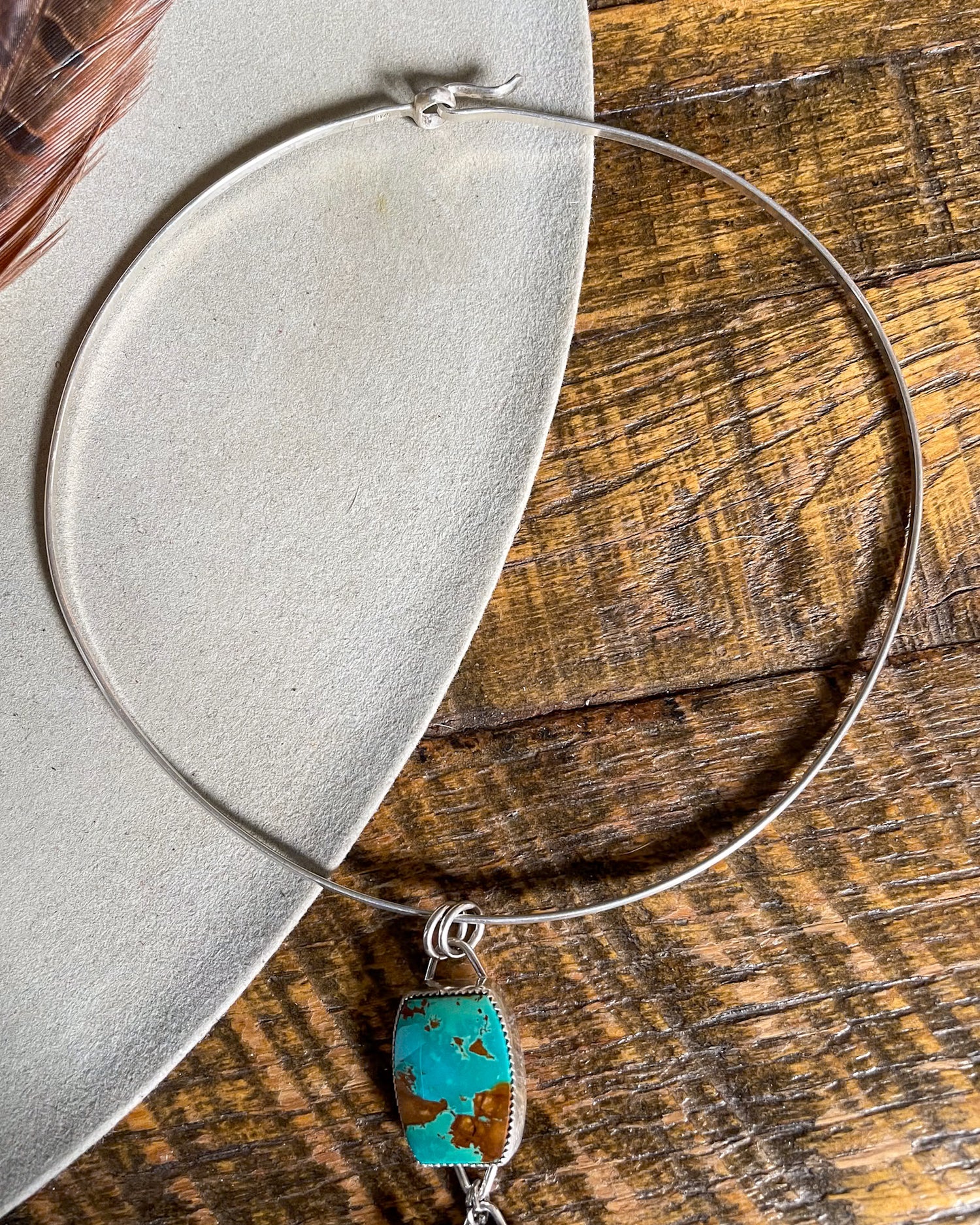 silver collar style necklace with turquoise pendant