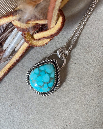 white water turquoise pendant with twisted border on dainty chain