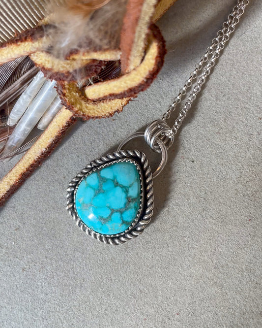 white water turquoise pendant with twisted border on dainty chain