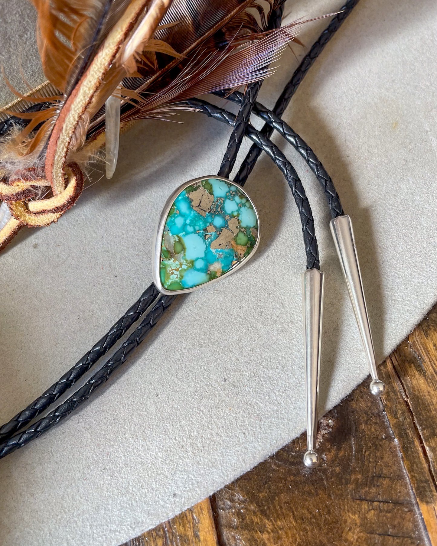Bolo tie with turquoise stone and silver tips 