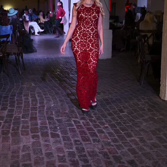 woman wearing red dress and ithaca peak turquoise and grey moonstone necklace with matching two stone turquoise ring and grey moonstone earrings walking on runway