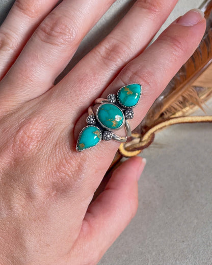 three stone emerald valley turquoise ring with floral accents on split shank band