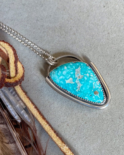 white water turquoise pendant with smooth silver border on dainty rolo chain