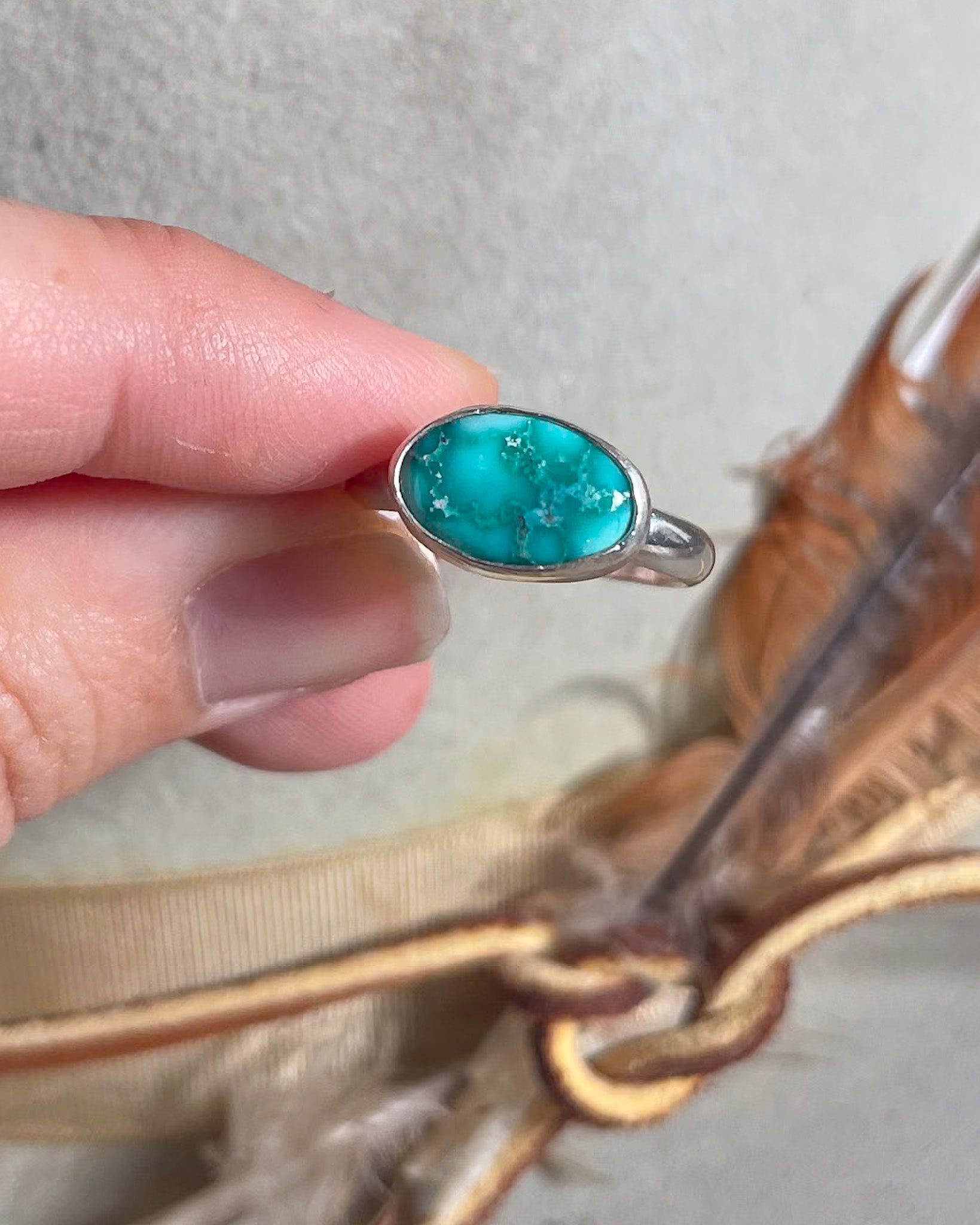 aqua blue turquoise horizonal ring with smooth bezel and silver band